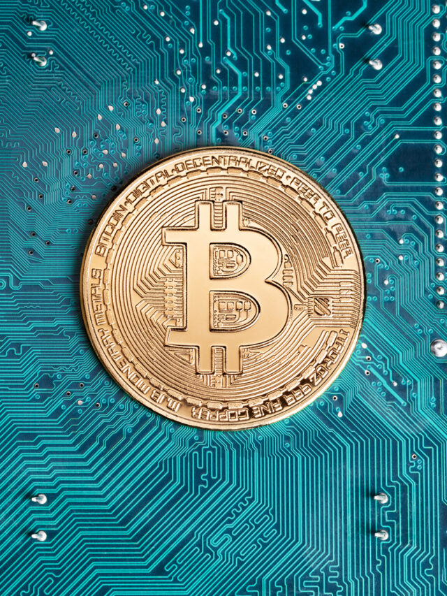 Golden bitcoin replica on computer circuit board